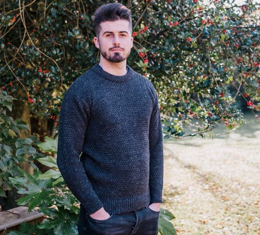 Man in charcoal coloured wool sweater
