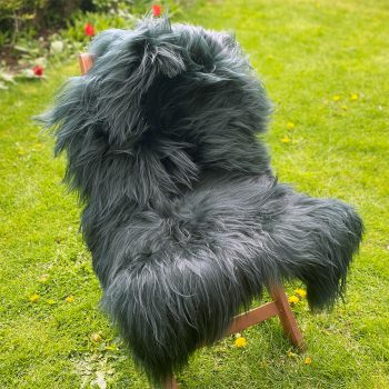 Green Icelandic sheepskin rug on a chair