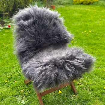 Dark grey icelandic sheepskin rug on a chair