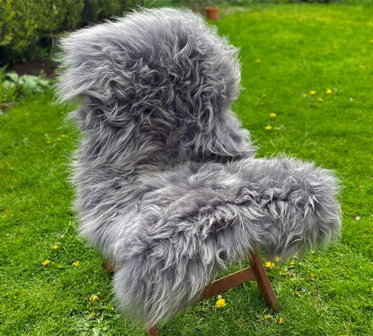 Slate grey icelandic sheepskin rug on a chair