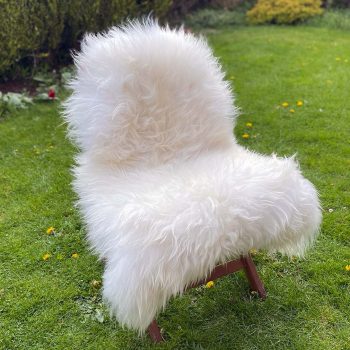 Natural white icelandic sheepskin rug on a chair