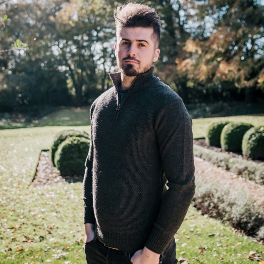Green zip neck wool jumper on model