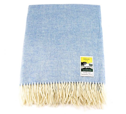 Blue herringbone travel rug throw laid flat