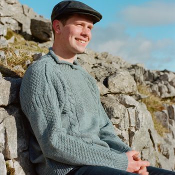 Farmer wearing Blue wool tarbert fishing jumper