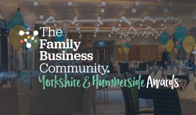 Family Business Awards logo in front of empty awards dinner set up